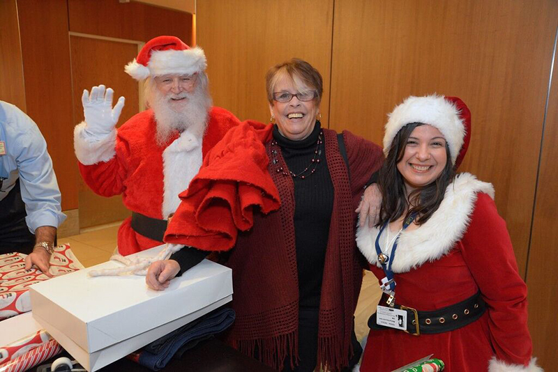 Santa’s Helpers Wrapping Party attendee Kathleen Talbot with Santa